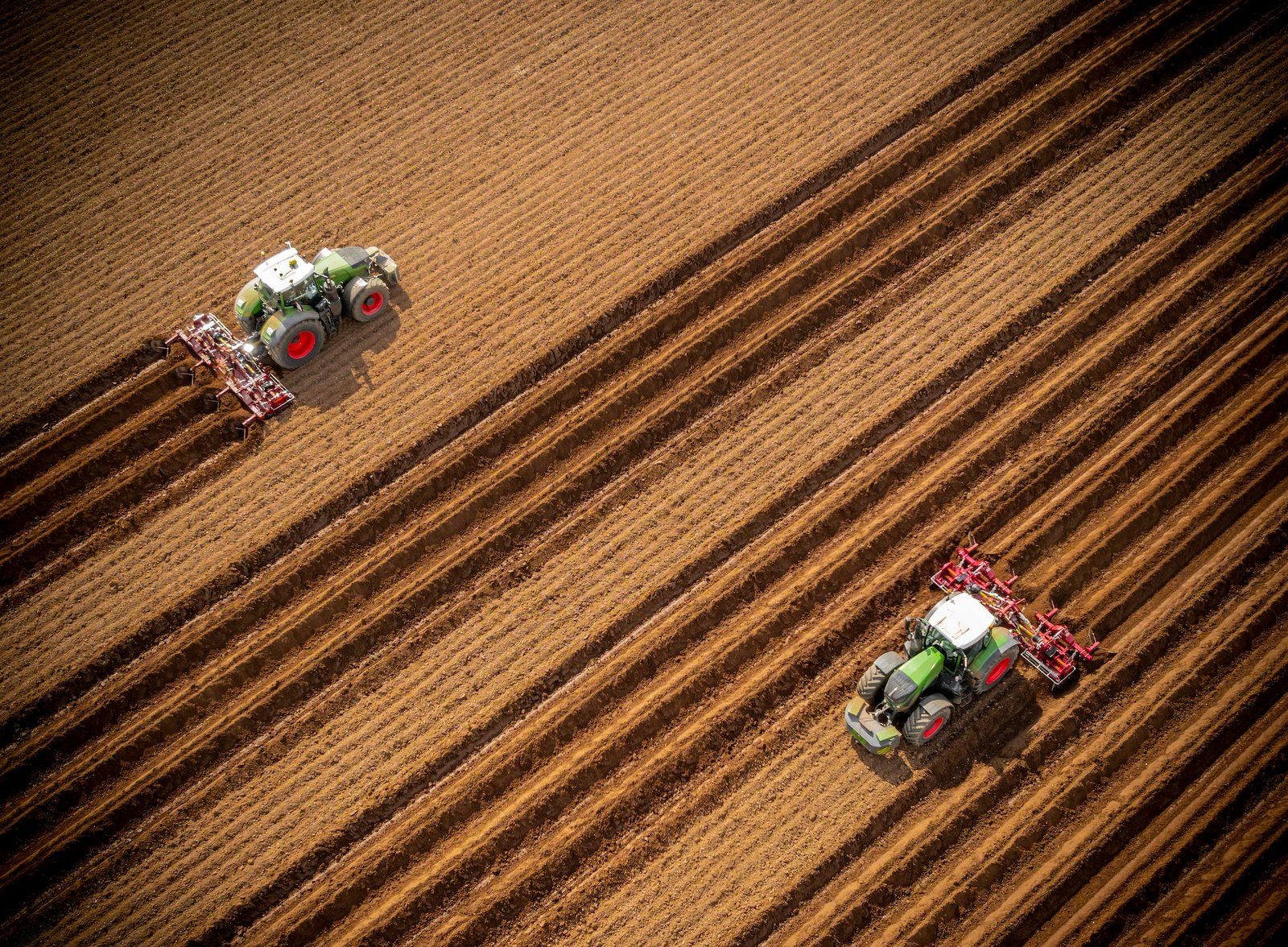 Tracctors preparing the fields to grow farm-fresh potatoes