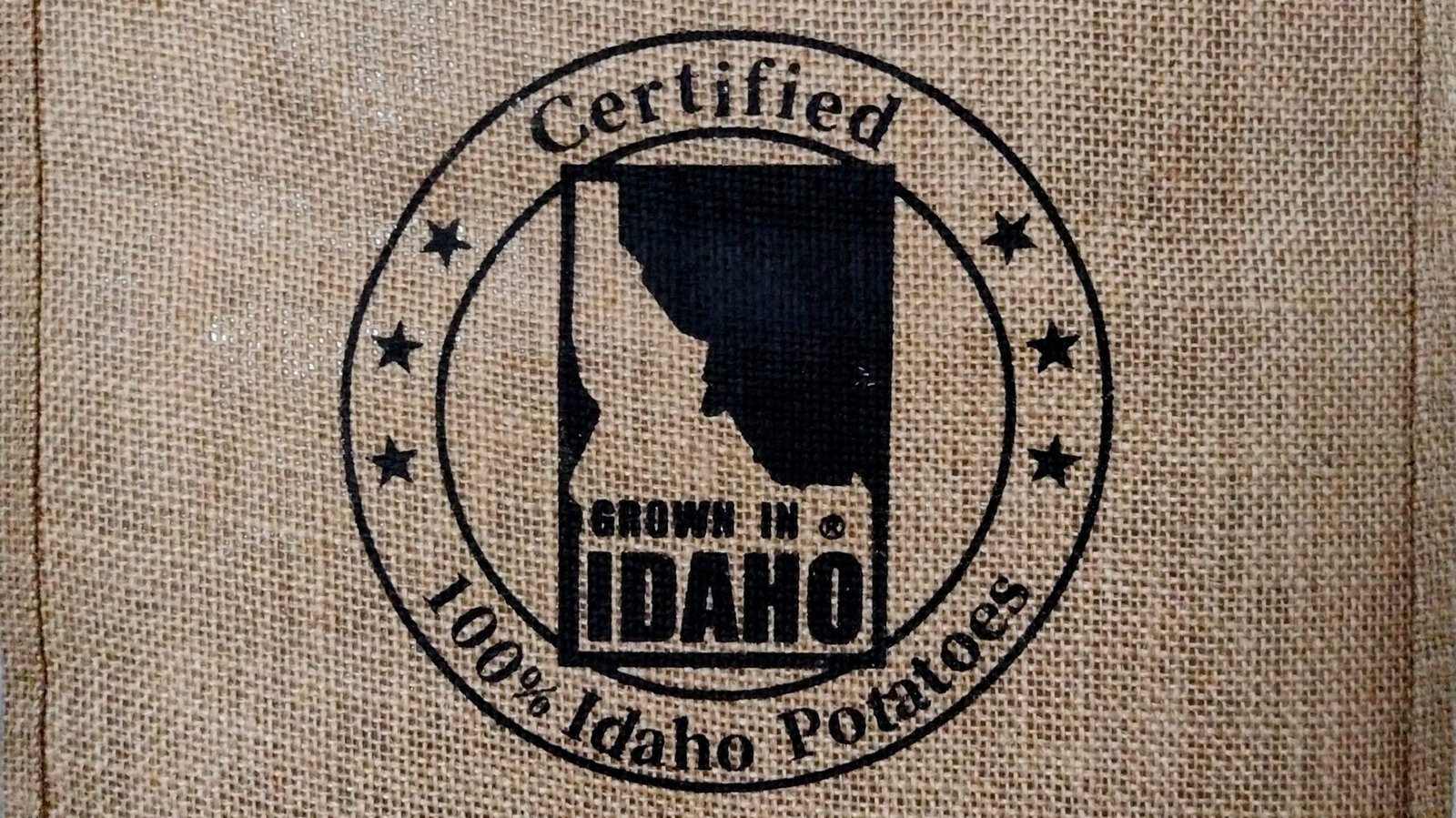 Certified grown in idaho logo on burlap texture